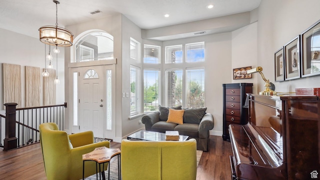 372 N Waterside Rd W, Heber City, UT 84032 - living area with a high ceiling, wood finished floors, baseboards, recessed lighting, and a chandelier