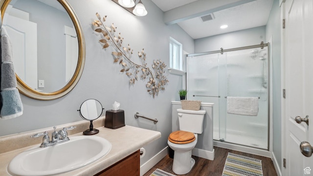 372 N Waterside Rd W, Heber City, UT 84032 - full bathroom featuring toilet, a stall shower, vanity, wood finished floors, and baseboards