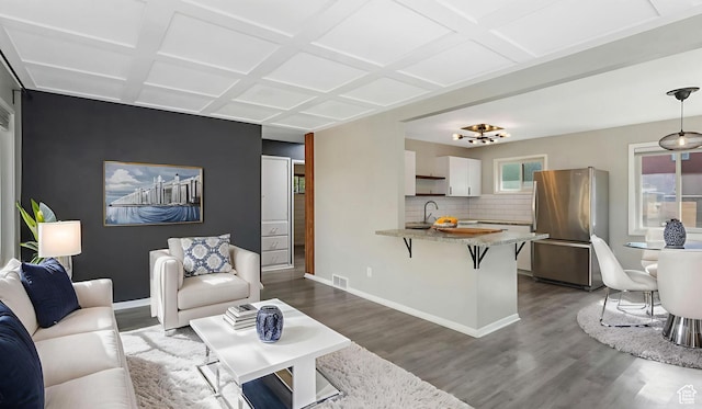 1276 W 1100 N, Salt Lake City, UT 84116 - living area with dark wood-style floors, baseboards, and coffered ceiling