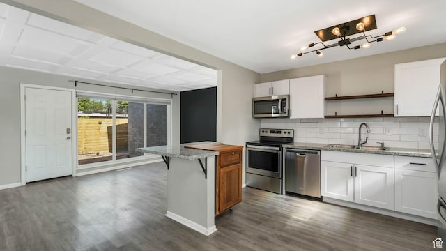1276 W 1100 N, Salt Lake City, UT 84116 - kitchen with stainless steel appliances, a sink, open shelves, backsplash, and dark wood finished floors