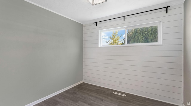 1276 W 1100 N, Salt Lake City, UT 84116 - empty room featuring dark wood-style floors, baseboards, ornamental molding, and wood walls
