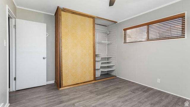 1276 W 1100 N, Salt Lake City, UT 84116 - unfurnished bedroom with crown molding, wood finished floors, a closet, baseboards, and a ceiling fan