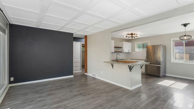 1276 W 1100 N, Salt Lake City, UT 84116 - kitchen with freestanding refrigerator, a sink, a peninsula, coffered ceiling, and dark wood-type flooring