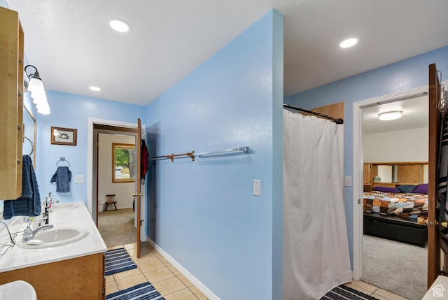 155 S 200 W, Gunnison, UT 84634 - ensuite bathroom featuring tile patterned flooring, double vanity, recessed lighting, and curtained shower