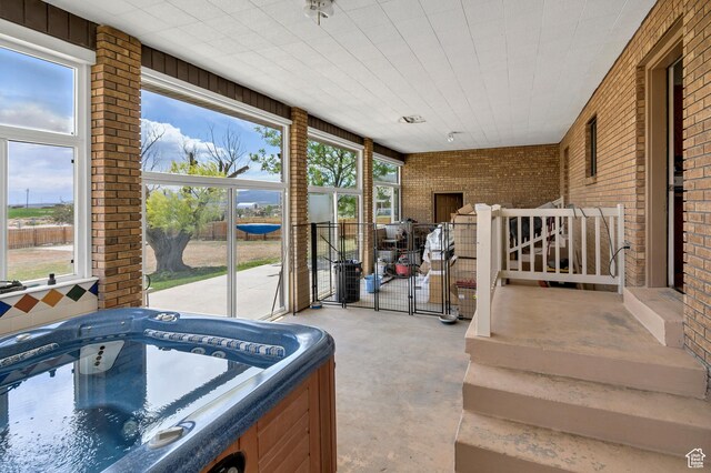 155 S 200 W, Gunnison, UT 84634 - sunroom featuring a jacuzzi and healthy amount of natural light