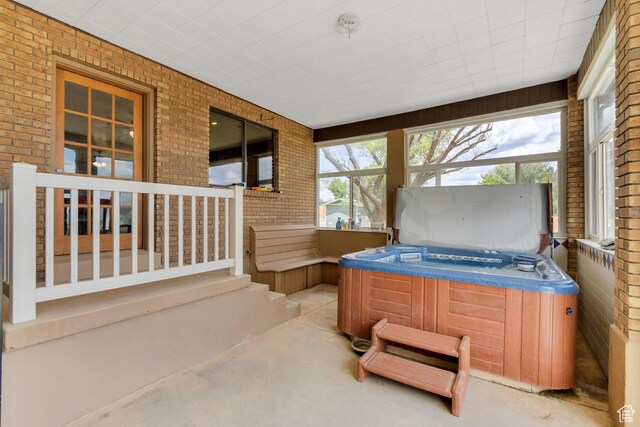 155 S 200 W, Gunnison, UT 84634 - sunroom featuring a hot tub and plenty of natural light