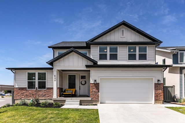 849 N Evelyn St W, Farmington, UT 84025 - craftsman-style house with an attached garage, brick siding, a porch, and concrete driveway