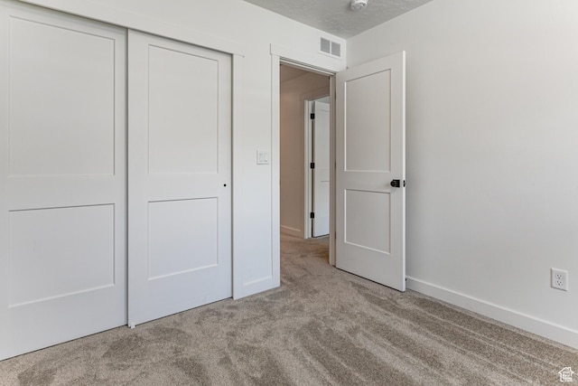 849 N Evelyn St W, Farmington, UT 84025 - unfurnished bedroom featuring carpet floors, a closet, and baseboards