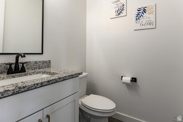849 N Evelyn St W, Farmington, UT 84025 - bathroom featuring vanity, toilet, and baseboards