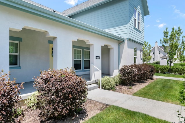 4908 W Duckhorn Dr, South Jordan, UT 84009 - view of exterior entry featuring a porch and stucco siding