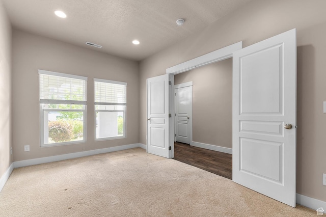 4908 W Duckhorn Dr, South Jordan, UT 84009 - unfurnished bedroom with carpet, baseboards, recessed lighting, and a textured ceiling