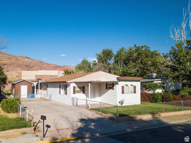 476 Cliffview Dr, Moab, UT 84532 - view of front of house featuring a mountain view