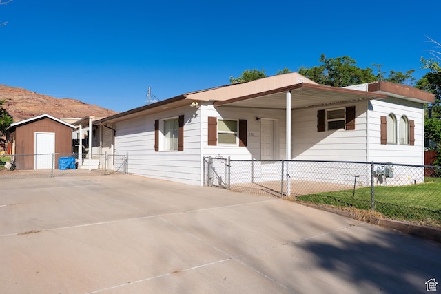 476 Cliffview Dr, Moab, UT 84532 - view of front of house featuring a gate and covered porch