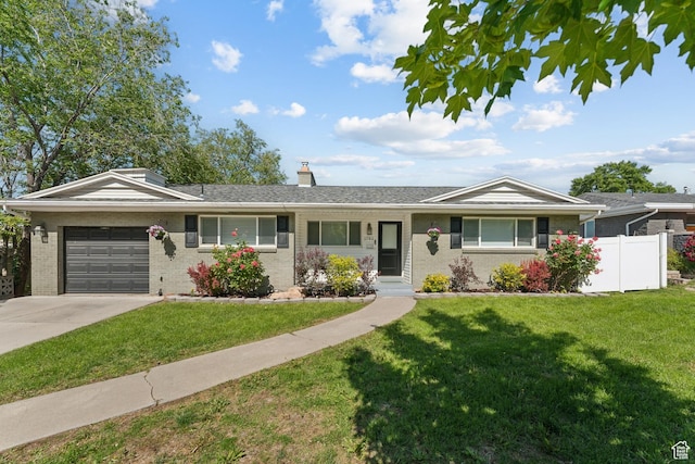 1792 S Laurelhurst Dr E, Salt Lake City, UT 84108 - ranch-style home with an attached garage, brick siding, concrete driveway, and a chimney