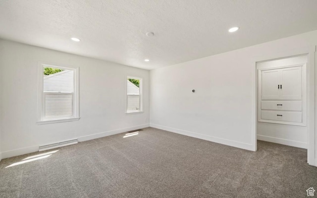 133 Country Club Dr, South Ogden, UT 84405 - empty room with carpet flooring, recessed lighting, plenty of natural light, baseboards, and a textured ceiling