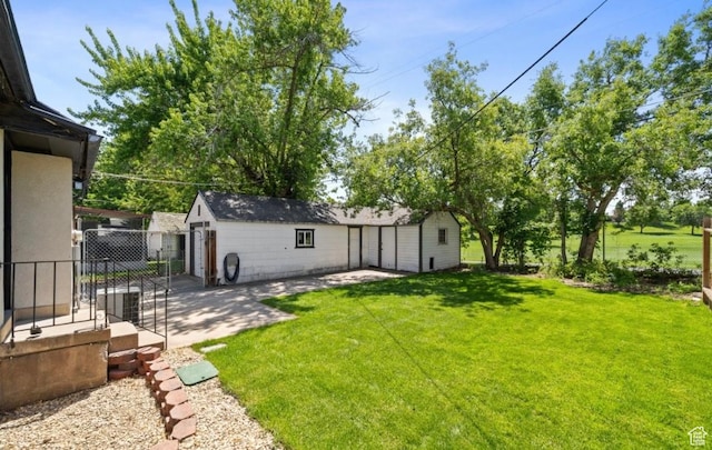 133 Country Club Dr, South Ogden, UT 84405 - view of yard with an outbuilding and a patio area