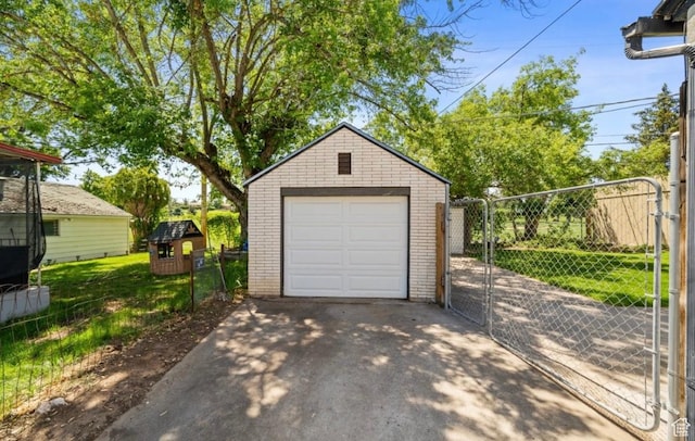 133 Country Club Dr, South Ogden, UT 84405 - detached garage featuring driveway and a gate