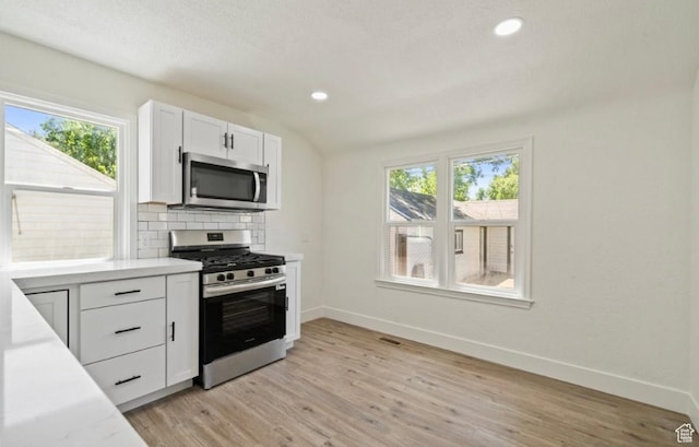133 Country Club Dr, South Ogden, UT 84405 - kitchen featuring appliances with stainless steel finishes, baseboards, backsplash, light countertops, and recessed lighting
