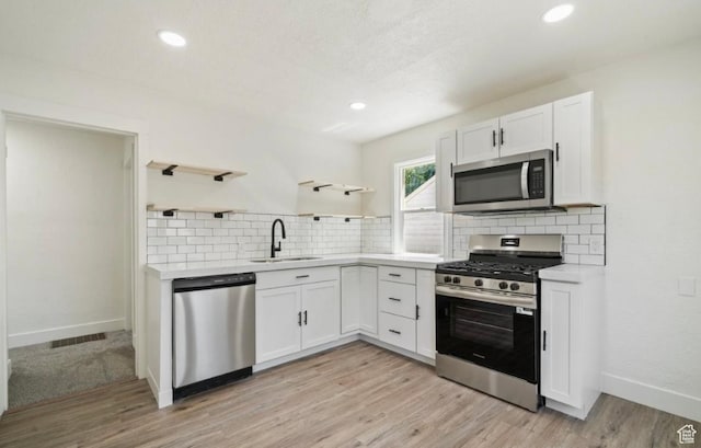 133 Country Club Dr, South Ogden, UT 84405 - kitchen featuring appliances with stainless steel finishes, open shelves, a sink, white cabinetry, and recessed lighting