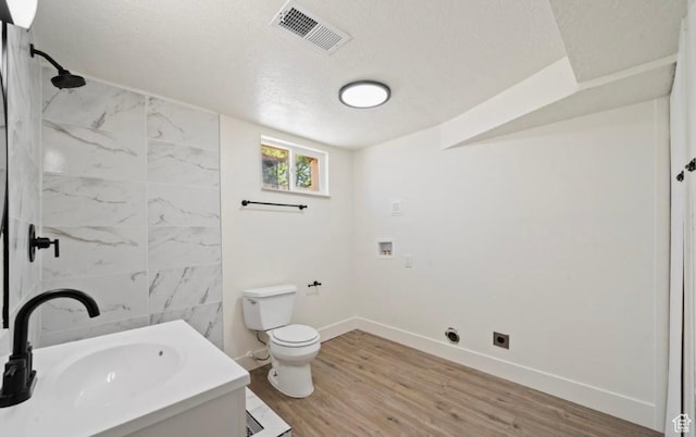 133 Country Club Dr, South Ogden, UT 84405 - bathroom featuring toilet, a textured ceiling, a shower, baseboards, and vanity
