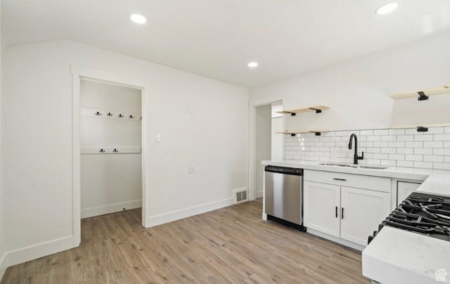 133 Country Club Dr, South Ogden, UT 84405 - kitchen with open shelves, stainless steel dishwasher, a sink, backsplash, and white cabinets
