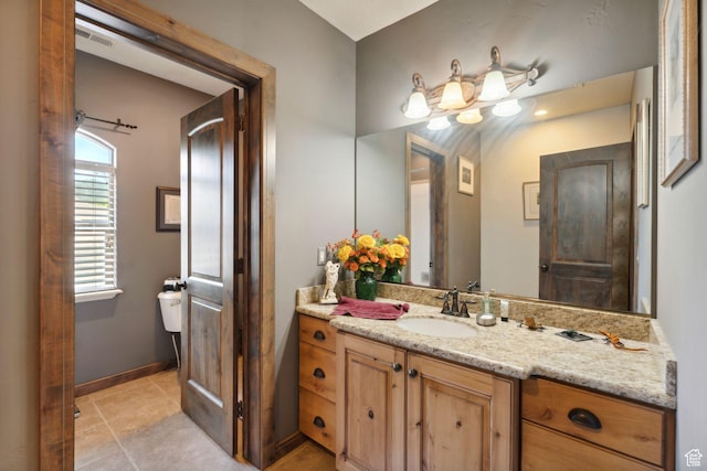 13302 S Corner Wood Dr E, Draper, UT 84020 - bathroom with toilet, vanity, tile patterned floors, and baseboards