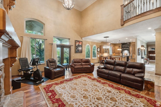 13302 S Corner Wood Dr E, Draper, UT 84020 - living area with light wood-type flooring, ornamental molding, a high ceiling, and decorative columns