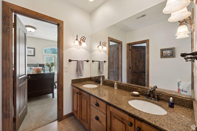 13302 S Corner Wood Dr E, Draper, UT 84020 - bathroom featuring double vanity and baseboards