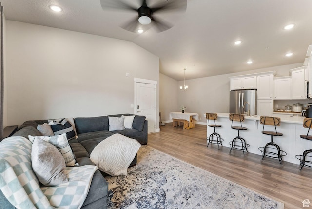 1128 S 820 E Unit 3301, Heber City, UT 84032 - living area with light wood-type flooring, ceiling fan, recessed lighting, vaulted ceiling, and baseboards