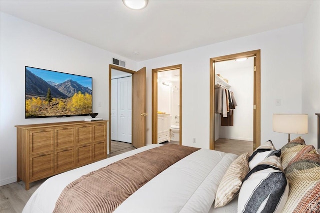 531 S 900 E Unit B2, Salt Lake City, UT 84102 - bedroom with a closet, light wood-style floors, ensuite bathroom, and baseboards