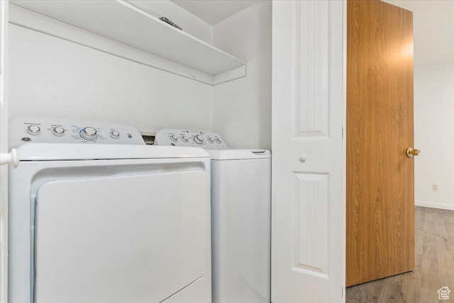 531 S 900 E Unit B2, Salt Lake City, UT 84102 - laundry area featuring separate washer and dryer, light wood finished floors, and baseboards