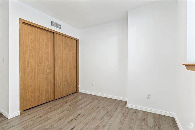 531 S 900 E Unit B2, Salt Lake City, UT 84102 - unfurnished bedroom featuring light wood-style flooring, baseboards, and a closet