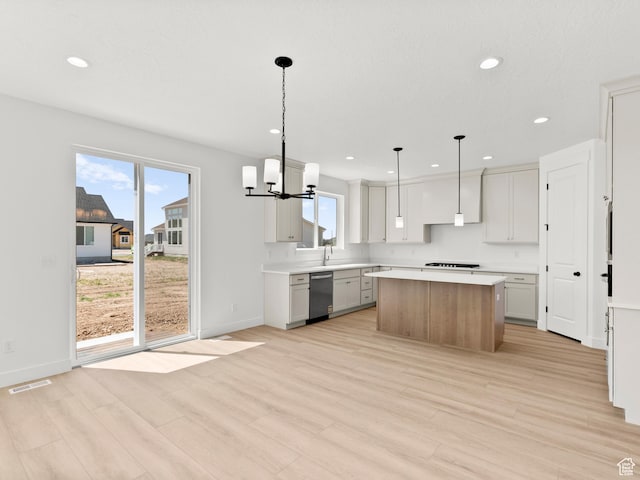 325 N 1040 E Unit 26, Salem, UT 84653 - kitchen featuring dishwasher, a center island, light wood finished floors, light countertops, and recessed lighting