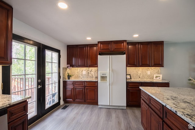 366 S 3240 W, Vernal, UT 84078 - kitchen with white fridge with ice dispenser, french doors, backsplash, light wood-type flooring, and recessed lighting