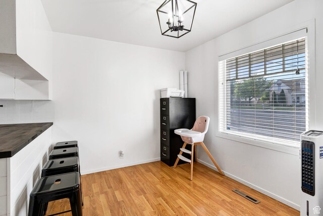 345 W 300 N, Richfield, UT 84701 - office area featuring light wood-type flooring, a chandelier, heating unit, and baseboards