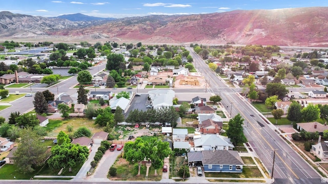 345 W 300 N, Richfield, UT 84701 - aerial view of property and surrounding area featuring nearby suburban area and mountains