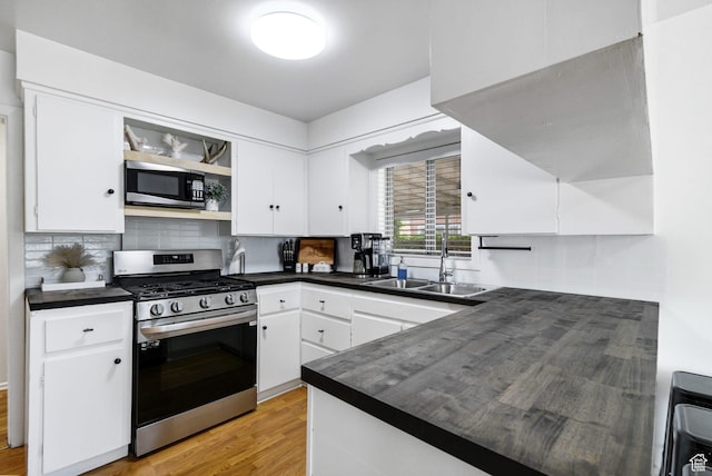 345 W 300 N, Richfield, UT 84701 - kitchen with appliances with stainless steel finishes, a sink, dark countertops, open shelves, and white cabinetry