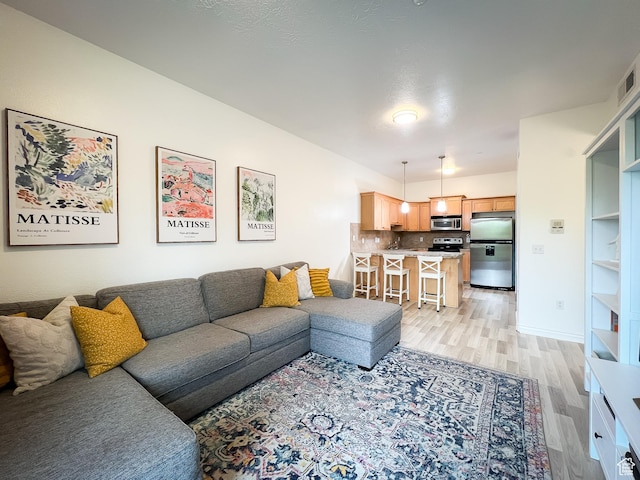 1174 E 3300 S Unit 314, Salt Lake City, UT 84106 - living room with light wood-style flooring and baseboards