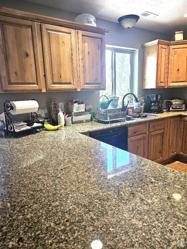 3788 S 410 W, Vernal, UT 84078 - kitchen with a sink, brown cabinets, dark stone counters, and dishwasher