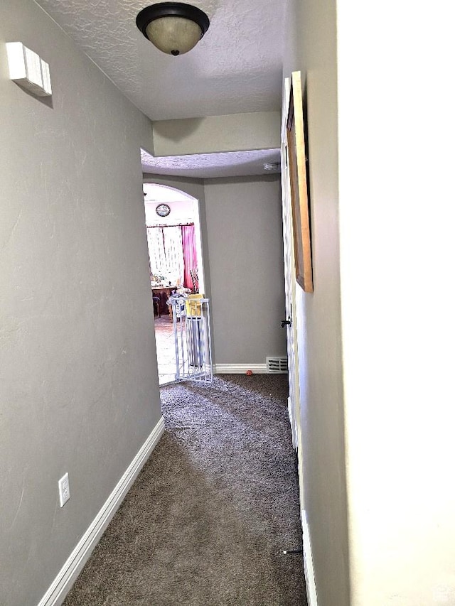 3788 S 410 W, Vernal, UT 84078 - hallway with carpet flooring, baseboards, and a textured ceiling
