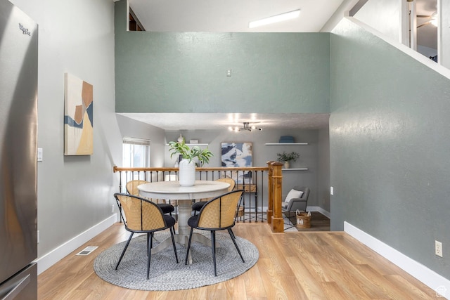 10297 S Weeping Willow Dr E, Sandy, UT 84070 - dining area featuring light wood finished floors and baseboards