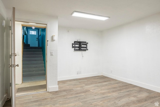 10297 S Weeping Willow Dr E, Sandy, UT 84070 - empty room with stairway, wood finished floors, and baseboards
