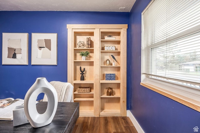 10297 S Weeping Willow Dr E, Sandy, UT 84070 - living area with dark wood-style flooring and baseboards