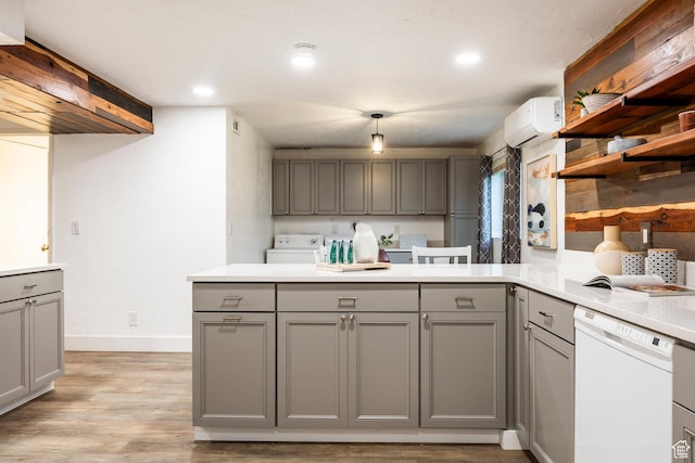 10297 S Weeping Willow Dr E, Sandy, UT 84070 - kitchen with gray cabinets, white dishwasher, a peninsula, light countertops, and recessed lighting