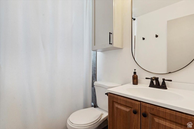 1142 W Fremont Ave, Salt Lake City, UT 84104 - bathroom with toilet, vanity, and a shower with shower curtain