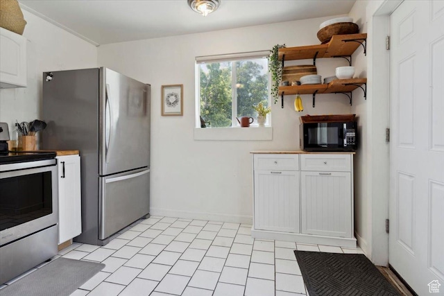 1142 W Fremont Ave, Salt Lake City, UT 84104 - kitchen featuring stainless steel appliances, open shelves, white cabinetry, and baseboards