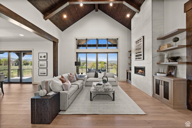 113 N Haystack Mountain Dr Unit 2, Heber City, UT 84032 - living room with high vaulted ceiling, a tile fireplace, light wood-type flooring, wood ceiling with exposed beams, and recessed lighting