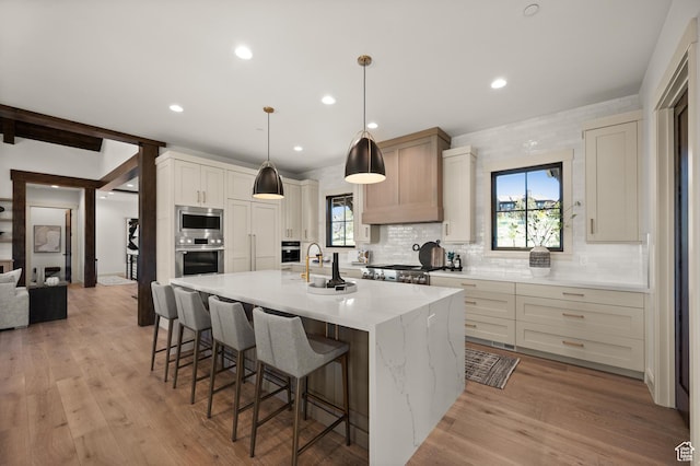 113 N Haystack Mountain Dr Unit 2, Heber City, UT 84032 - kitchen featuring appliances with stainless steel finishes, backsplash, a breakfast bar area, healthy amount of natural light, and recessed lighting