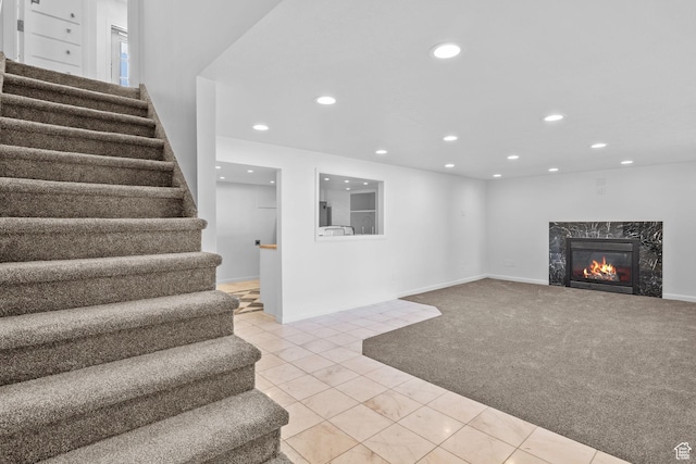 2858 S 50 W, Bountiful, UT 84010 - basement featuring stairway, recessed lighting, a premium fireplace, light carpet, and baseboards