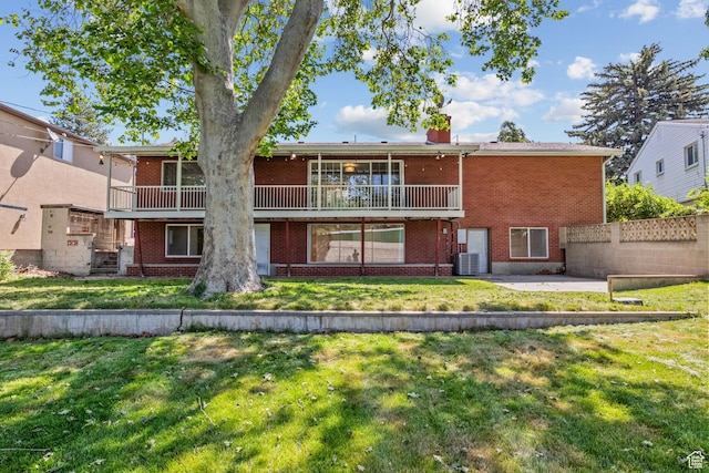 2858 S 50 W, Bountiful, UT 84010 - rear view of house featuring brick siding, a chimney, a patio area, and central AC